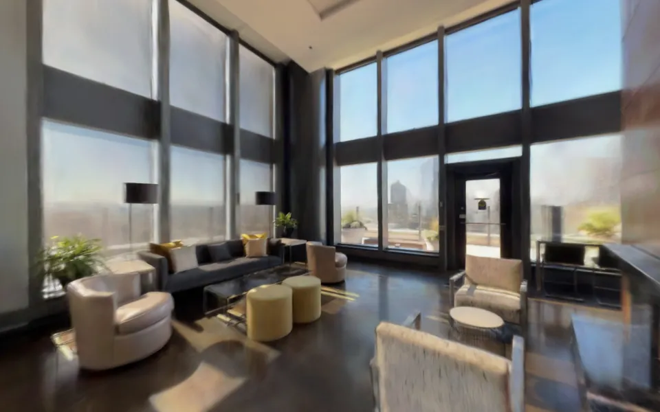 Sofas and armchairs under floor-to-ceiling windows in the sky lounge twin.
